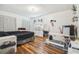Bedroom with a queen bed, desk, and wood-look flooring at 25555 Oaks Blvd, Land O Lakes, FL 34639