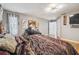 Spacious bedroom with hardwood floors and a large bed at 25555 Oaks Blvd, Land O Lakes, FL 34639