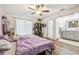 Bedroom with two twin beds, en-suite bathroom access, and sliding glass doors at 25555 Oaks Blvd, Land O Lakes, FL 34639