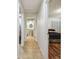 Hallway with bathroom and bedroom access, tile flooring throughout at 25555 Oaks Blvd, Land O Lakes, FL 34639