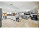 Open kitchen features stainless steel appliances and a breakfast bar at 25555 Oaks Blvd, Land O Lakes, FL 34639