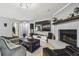 Living room with fireplace, large TV, and comfortable seating at 25555 Oaks Blvd, Land O Lakes, FL 34639