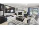 Living area features a fireplace and a large TV at 25555 Oaks Blvd, Land O Lakes, FL 34639
