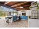 Outdoor kitchen with grill, sink, and ample counter space at 25555 Oaks Blvd, Land O Lakes, FL 34639