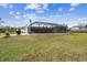 Large, screened-in pool with patio at 25555 Oaks Blvd, Land O Lakes, FL 34639
