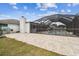 Large screened-in pool and patio area at 25555 Oaks Blvd, Land O Lakes, FL 34639