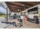Covered patio with entertainment area and gym at 25555 Oaks Blvd, Land O Lakes, FL 34639