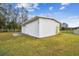 White metal workshop building with large roll-up door at 25555 Oaks Blvd, Land O Lakes, FL 34639