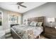 Main bedroom with king-size bed and sliding doors leading to the pool and spa at 2737 Valencia Grove Dr, Valrico, FL 33596