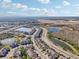 Aerial view of community with lake, road and townhouses at 29857 Southwell Ln, Wesley Chapel, FL 33543