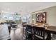 Dining room with a large wooden table and a view of the living room at 29857 Southwell Ln, Wesley Chapel, FL 33543