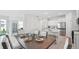 Open floor plan with kitchen island and dining area at 32652 Rustic Rise Rd, San Antonio, FL 33576