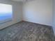 Bright bedroom with window and neutral carpeting at 3447 Loveland Blvd, Port Charlotte, FL 33980