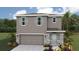 Two-story house with gray siding, stone accents, and a two-car garage at 3467 Hilltop Cir, Lakewood Ranch, FL 34211
