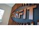 Close-up of StarFit fitness center logo on wood wall at 3467 Hilltop Cir, Lakewood Ranch, FL 34211
