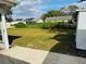 Large grassy backyard with shed and neighboring homes visible at 3628 Dellefield St, New Port Richey, FL 34655