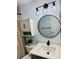 Updated bathroom features a vanity with quartz countertop, modern fixtures, and stylish decor at 3628 Dellefield St, New Port Richey, FL 34655