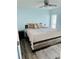 Main bedroom with ceiling fan and wood-look flooring at 3628 Dellefield St, New Port Richey, FL 34655