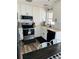 Modern white kitchen with stainless steel appliances and subway tile backsplash at 3628 Dellefield St, New Port Richey, FL 34655