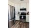 Stainless steel appliances and white shaker cabinets in this updated kitchen at 3628 Dellefield St, New Port Richey, FL 34655
