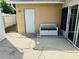 Small patio area with storage building and a bench at 3628 Dellefield St, New Port Richey, FL 34655