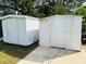 Two storage sheds in the backyard provide ample storage space at 3628 Dellefield St, New Port Richey, FL 34655