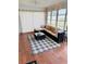Bright sunroom with comfortable sectional sofa and stylish decor at 3628 Dellefield St, New Port Richey, FL 34655