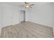 Bright bedroom with ceiling fan and wood-look flooring at 36385 Flats St, Zephyrhills, FL 33541