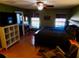 Large main bedroom with wood floors, a king-size bed, and ample closet space at 37733 Dunbar Ave, Zephyrhills, FL 33542