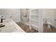 Bathroom with double vanity, soaking tub, and separate shower at 3946 Doral Dr, Tampa, FL 33634