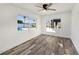 Bedroom with pool view and wood-look floors at 3946 Doral Dr, Tampa, FL 33634