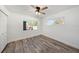 Bright bedroom with wood-look flooring and ceiling fan at 3946 Doral Dr, Tampa, FL 33634