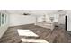 Modern kitchen with wood-look island, white cabinets, and stainless steel appliances at 3946 Doral Dr, Tampa, FL 33634