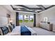 Spacious bedroom with a king-size bed and large windows at 4318 Pullet Ct, Lakewood Ranch, FL 34211