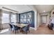 Bright dining room with a modern table and blue accent wall at 4318 Pullet Ct, Lakewood Ranch, FL 34211