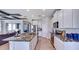 Open concept kitchen with white cabinets, granite countertops and island at 4318 Pullet Ct, Lakewood Ranch, FL 34211