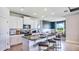 Modern kitchen with white cabinets, granite countertops, and island seating at 4318 Pullet Ct, Lakewood Ranch, FL 34211