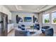 Relaxing sitting area with comfortable armchairs and a large TV at 4318 Pullet Ct, Lakewood Ranch, FL 34211