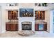 Stone fireplace with built-in cabinetry and wet bar at 4919 Turtle Creek Trl, Oldsmar, FL 34677