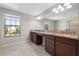 Double vanity bathroom with granite countertop at 5048 Ivory Stone Dr, Wimauma, FL 33598