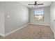 Spacious bedroom with large window and carpet at 5048 Ivory Stone Dr, Wimauma, FL 33598