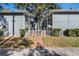 View of two-story gray homes and courtyard at 506 S Willow Ave # 11, Tampa, FL 33606