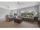 Spacious living room with gray sofas and large windows at 5500 Denver Ne St, St Petersburg, FL 33703