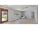 Bright and airy living room with hardwood floors and access to the front yard at 5500 Denver Ne St, St Petersburg, FL 33703