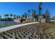 Landscaped entrance with water feature and palm trees at 5531 Orsello St, Palmetto, FL 34221