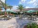 Outdoor seating area with umbrellas near the pool at 5531 Orsello St, Palmetto, FL 34221
