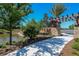Walkway with stone wall and pergola next to a pond at 5531 Orsello St, Palmetto, FL 34221