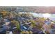 Aerial view of the house and neighborhood near the lake at 6709 Ranger Dr, Tampa, FL 33615