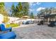 Spacious backyard with patio furniture and pool access at 6709 Ranger Dr, Tampa, FL 33615
