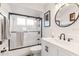 Clean bathroom with a bathtub, shower, and modern vanity at 6709 Ranger Dr, Tampa, FL 33615